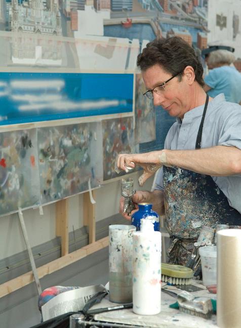 Ben spray painted the Liverpool Cityscape before hand-finishing with small sable brushes. Photo © Simon Webb.